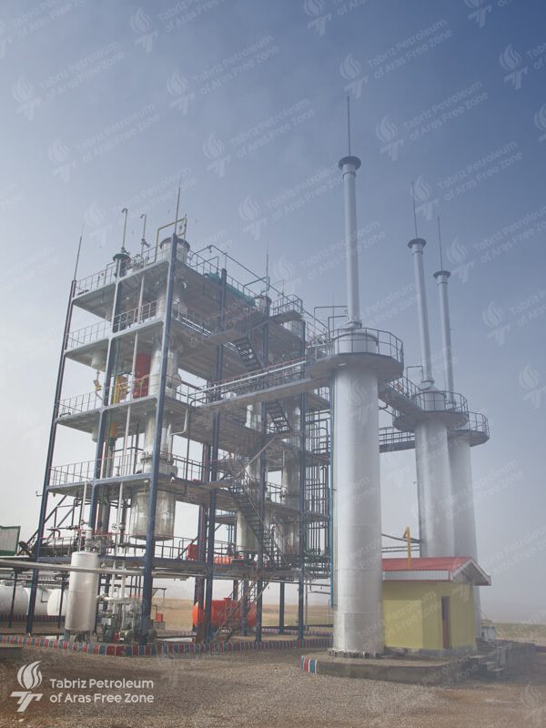 A vast refinery complex with towering distillation towers and an intricate network of pipelines, representing the intricate process of petroleum refining.-3